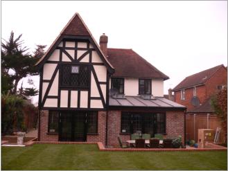 Hand cut vaulted ceiling, roof extension with Tudor cladding and leaded lower area.